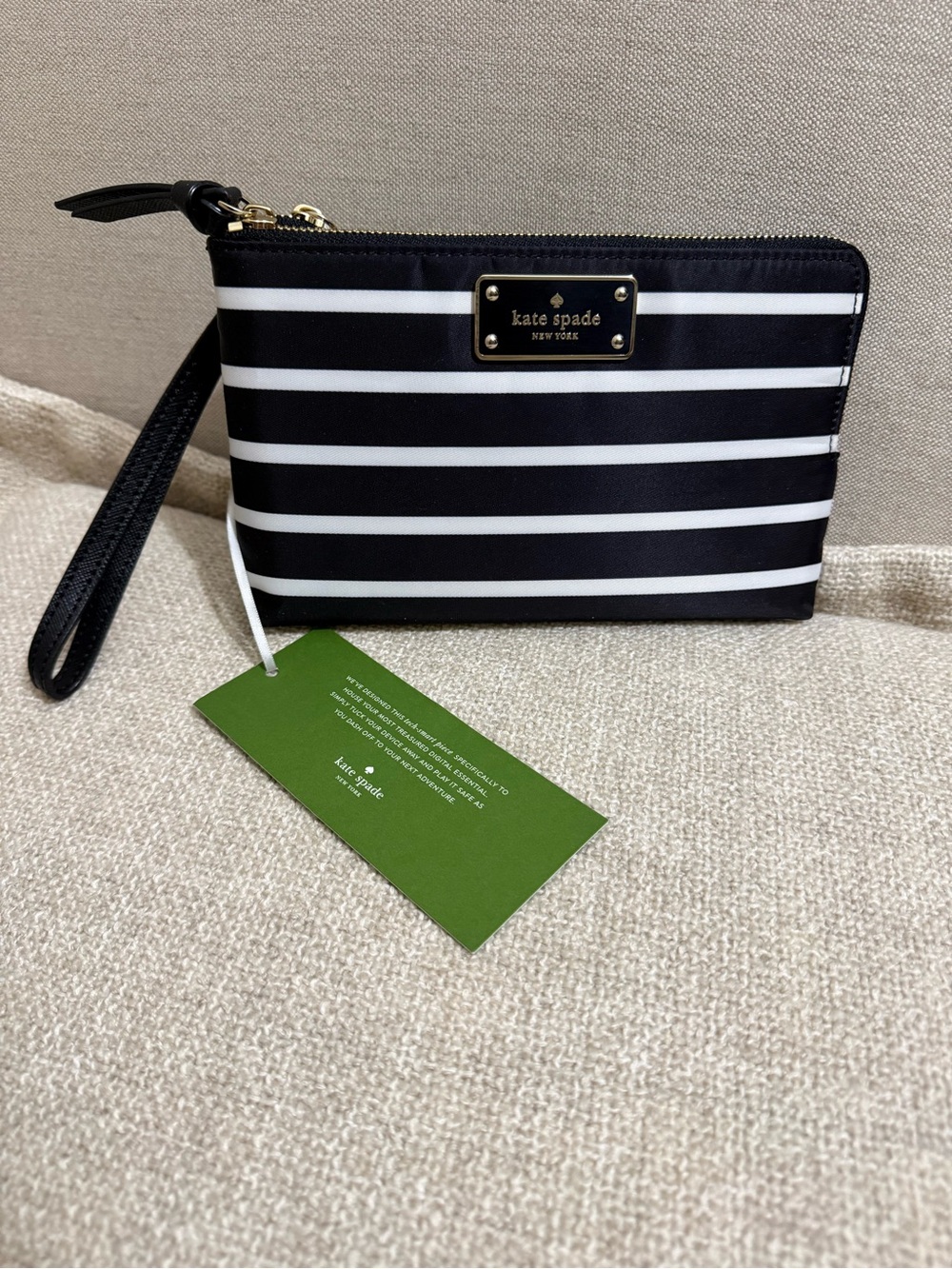 kate spade Black and White Striped Wristlet with Gold Plaque